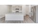Modern kitchen boasts a large island with granite countertops, stainless steel appliances, and light gray cabinets at 17847 Dandy Brush Dr, Parker, CO 80134