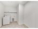 Laundry room with a washing machine and vinyl flooring at 17847 Dandy Brush Dr, Parker, CO 80134