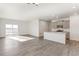 Bright and airy living space with hardwood floors, an open layout, and access to the backyard at 17847 Dandy Brush Dr, Parker, CO 80134