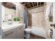 Bathroom with stylish vanity, decorative mirror, tiled shower, and neutral walls for a bright and clean aesthetic at 1940 W 101St Ct, Thornton, CO 80260