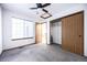 Neutral colored bedroom featuring a double closet and lots of natural light from the window at 1940 W 101St Ct, Thornton, CO 80260