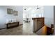 Open foyer with skylights, leading to a dining area, and living room with vaulted ceilings and neutral colored walls at 1940 W 101St Ct, Thornton, CO 80260