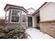 Welcoming home entrance featuring updated windows and a secure screen door at 1940 W 101St Ct, Thornton, CO 80260