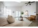 Bright living room with skylights and natural light featuring modern furniture and decor at 1940 W 101St Ct, Thornton, CO 80260