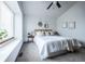 Bright main bedroom with a large window, comfortable carpet, and decorative wall art at 1940 W 101St Ct, Thornton, CO 80260