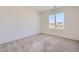 Bright bedroom with neutral-toned carpet and large windows at 1242 S Algonquian, Aurora, CO 80018