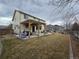 Spacious backyard featuring a patio with a pergola and a well-manicured lawn at 13018 Niagara Way, Thornton, CO 80602