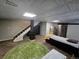 Finished basement area featuring a decorative ceiling, stairway to upstairs, and a decorative rug at 13018 Niagara Way, Thornton, CO 80602