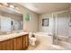 Bright bathroom featuring double vanity, soaking tub, and separate shower for a relaxing and convenient experience at 13018 Niagara Way, Thornton, CO 80602