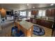 A kitchen featuring an island with bar stool seating at 13018 Niagara Way, Thornton, CO 80602