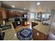 A spacious kitchen featuring an island and stainless steel appliances at 13018 Niagara Way, Thornton, CO 80602