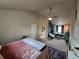 Bright main bedroom featuring an en-suite bathroom, workspace, ceiling fan, and lots of natural light at 13018 Niagara Way, Thornton, CO 80602