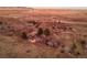 Aerial view of a house and surrounding area showcasing the property's expansive land at 12041 Twilight St, Longmont, CO 80503