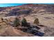 Aerial view showing a house nestled on a hillside, offering privacy and scenic views at 12041 Twilight St, Longmont, CO 80503