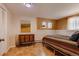 Charming basement bedroom with tiled floor and wood dresser at 12041 Twilight St, Longmont, CO 80503