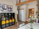 Bright dining area with built-in shelving and adjacent powder room at 12041 Twilight St, Longmont, CO 80503