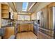 Modern kitchen featuring stainless steel appliances and wood cabinets at 12041 Twilight St, Longmont, CO 80503