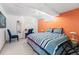 Finished basement bedroom featuring an egress window, desk, and modern decor at 415 Lamar St, Lakewood, CO 80226