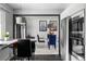 Dining area with glass table and views of stainless steel appliances and brightly painted accent walls at 415 Lamar St, Lakewood, CO 80226
