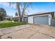 Long driveway leading to the house and garage, providing ample parking space and easy access at 415 Lamar St, Lakewood, CO 80226