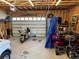 Well lit garage featuring motorcycles, and storage space at 415 Lamar St, Lakewood, CO 80226