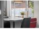 A bright breakfast bar in the kitchen looks out to a fenced yard at 415 Lamar St, Lakewood, CO 80226