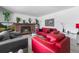 Stylish living room featuring an inviting fireplace and a comfortable seating arrangement for gatherings at 415 Lamar St, Lakewood, CO 80226