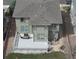 Aerial view of a home featuring a gray roof, light green siding, and a spacious white deck with outdoor seating at 5503 Fullerton Cir, Highlands Ranch, CO 80130