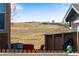 Backyard with a view overlooking a rolling hillside, with outdoor seating visible at 5503 Fullerton Cir, Highlands Ranch, CO 80130