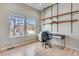 Bright bedroom with stylish shelving and three big windows providing great views at 5503 Fullerton Cir, Highlands Ranch, CO 80130
