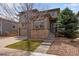 Charming two-story home featuring stone accents, landscaped front yard, and attached two-car garage at 5503 Fullerton Cir, Highlands Ranch, CO 80130