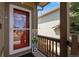 Welcoming front porch with a vibrant red door and a decorative welcome sign; a charming entrance at 5503 Fullerton Cir, Highlands Ranch, CO 80130