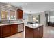 Eat-in kitchen features stainless steel appliances, granite countertops, wood cabinets, and eat-in nook at 5503 Fullerton Cir, Highlands Ranch, CO 80130