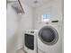 Bright laundry room featuring modern washer and dryer units at 5503 Fullerton Cir, Highlands Ranch, CO 80130