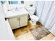 Bathroom with white cabinets, modern sink, toilet, and stylish shower curtain at 14413 E Jewell Ave # 201, Aurora, CO 80012
