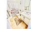 Bright bathroom with a floral shower curtain, modern sink, and wood grain floor at 14413 E Jewell Ave # 201, Aurora, CO 80012