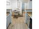 Charming dining area with wood-look flooring and a stylish glass-top table at 14413 E Jewell Ave # 201, Aurora, CO 80012
