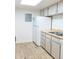 Bright kitchen featuring white refrigerator and lots of cabinet space for storage at 14413 E Jewell Ave # 201, Aurora, CO 80012