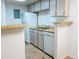 Efficient kitchen with modern appliances and wooden countertops at 14413 E Jewell Ave # 201, Aurora, CO 80012