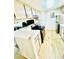 Well-lit kitchen features stainless appliances, white cabinets and breakfast bar at 14413 E Jewell Ave # 201, Aurora, CO 80012