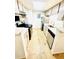 Efficient kitchen featuring stainless steel appliances and white cabinets at 14413 E Jewell Ave # 201, Aurora, CO 80012