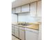 Well-equipped kitchen with wooden countertops and modern sink at 14413 E Jewell Ave # 201, Aurora, CO 80012