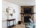 Inviting living room with stone fireplace and decorative accents at 14413 E Jewell Ave # 201, Aurora, CO 80012