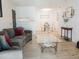 Open concept living room and dining area featuring modern decor and wood flooring at 14413 E Jewell Ave # 201, Aurora, CO 80012