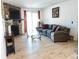 Inviting living room features a stone fireplace, wood floors, and sliding glass doors to the outside at 14413 E Jewell Ave # 201, Aurora, CO 80012