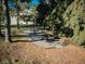 Community picnic area with tables and built-in grills, surrounded by trees and grassy areas at 14413 E Jewell Ave # 201, Aurora, CO 80012