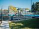 Community playground with swings, slides, and climbing structures, fully fenced for safe play at 14413 E Jewell Ave # 201, Aurora, CO 80012