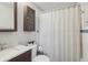 Bathroom features a vanity sink, white tiled walls, and a shower with curtain at 269 Beryl Way, Broomfield, CO 80020