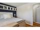 Well-lit bedroom featuring stylish decor, wood flooring, and a large window for natural light at 269 Beryl Way, Broomfield, CO 80020