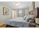 Bedroom with wood floors, a large bed, and natural light at 269 Beryl Way, Broomfield, CO 80020